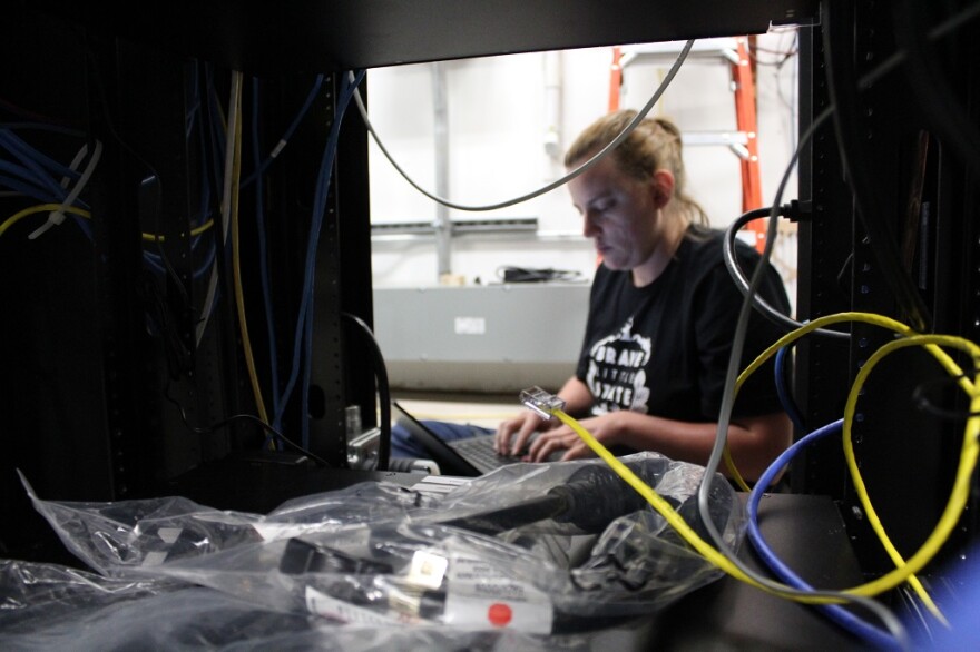 Parker configures a new uninterruptable power supply (UPS) for the equipment at the transmitter.