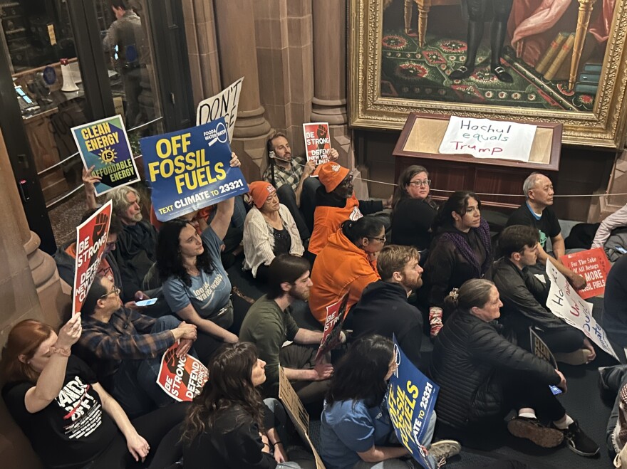 Protesters outside New York Gov. Kathy Hochul's office on March 25, 2026, in Albany urged her to back off her push to rollback regulations in the state's climate law.