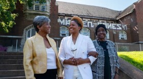 VaNetta Clark, a PhD candidate at Washington University in St. Louis, poses for a photo with her former Scullin School teachers Conchita Curry and Magnolia Bush-Tabb.