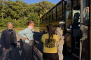 Christian and Melinda Krokus and Jill Baer head onto a bus tour of proposed data center campuses in Archbald. Tamara Misewicz-Healey, cofounder of the Stop Archbald Data Centers group, stands in the yellow shirt.