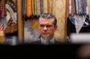 Defense Secretary Pete Hegseth listens as President Donald Trump speaks during a Cabinet meeting at the White House, Tuesday, Dec. 2, 2025, in Washington. (AP Photo/Julia Demaree Nikhinson)