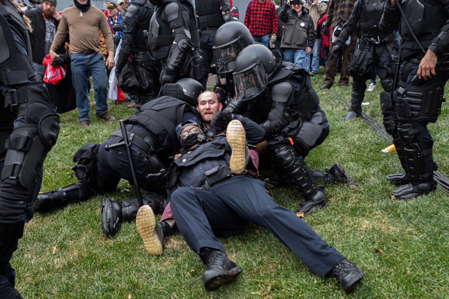 A pro-Trump protester resists arrest on Wednesday. There were few arrests in relation to the scope of the unrest as of Wednesday night.