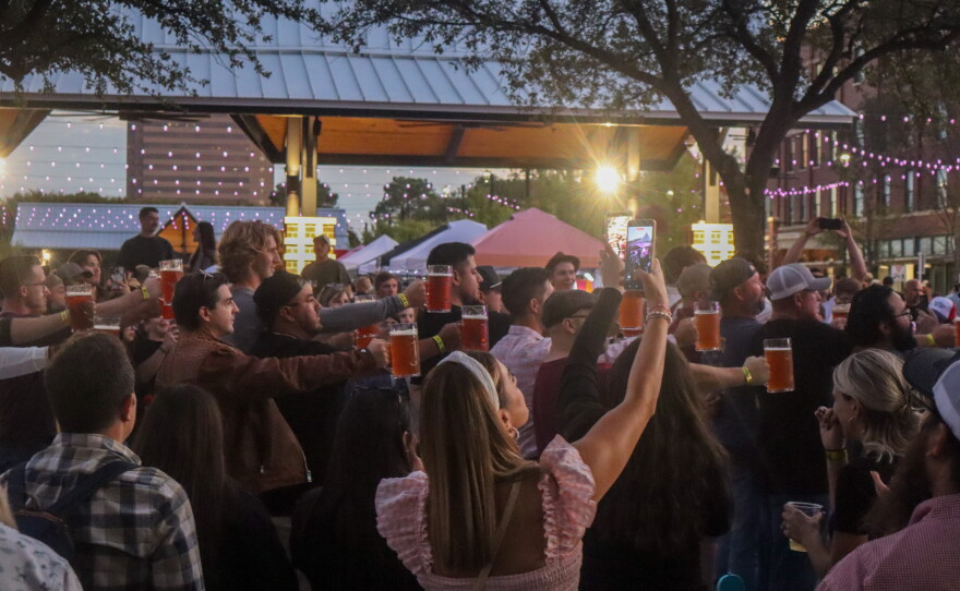Men Compete for Stein Holding Competition, photo by Emma Coats.