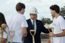 USF President Moez Limayem smiles with students at a groundbreaking ceremony for Uptown Landing. 
