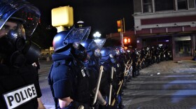 Police line up by Alamo Plaza on May 30. The protest became violent after sunset.