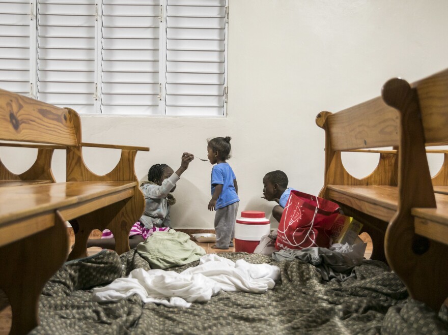 Kids have dinner at a shelter in a local church during the evening before the arrival of Hurricane Irma in Las Terrenas, Dominican Republic, on Wednesday.