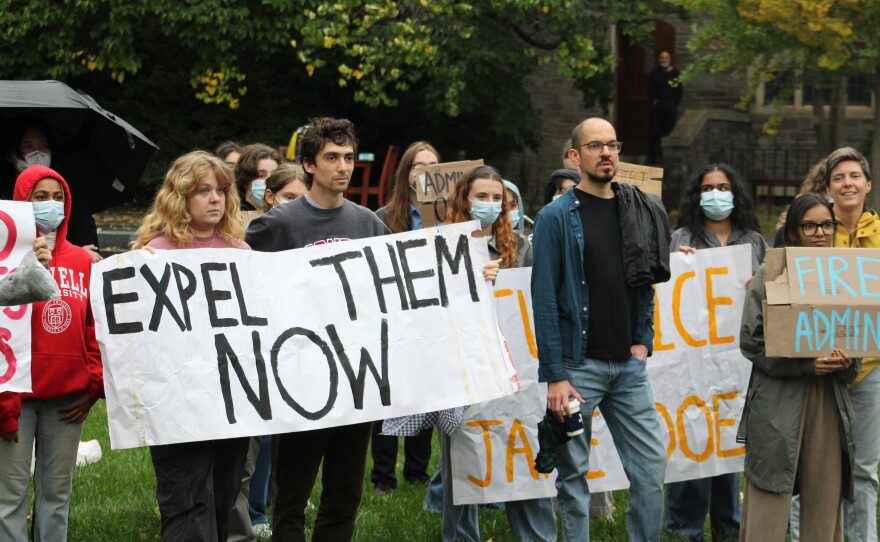 Protesters gathered in a courtyard outside the meeting of the Cornell Board of Trustees on Friday.