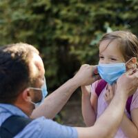 Parents need to make sure their kids' masks fit snugly and cover their mouths and noses.