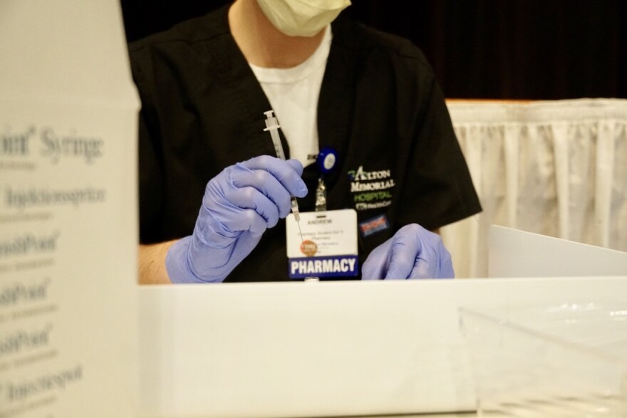 Pharmacy Tech Andrew Ballard fills syringes with the coronavirus vaccine at Christian Hospital in St. Louis on March 4, 2021. 