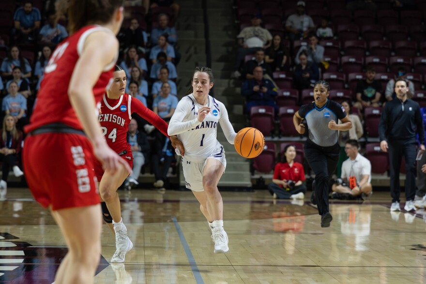 University of Scranton senior guard Kaeli Romanowski moves the ball down the court during Saturday's national championship game.