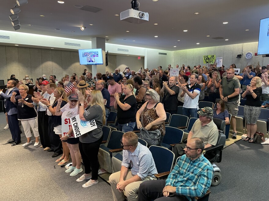 Hundreds of people, mostly unmasked, gathered at a St. Louis County Council meeting last week to protest a new mask mandate. St. Louis health officials confirmed this weekend that an attendee from St. Louis tested positive for the coronavirus, and they worry the event may spark a wider outbreak of the virus.