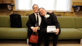 Same-sex couple Joseph and Jim pose for a photo as they wait to be officially married at the Manhattan City Clerk's Office on July 24, 2011, the first day gay couples were allowed to legally marry in New York. 