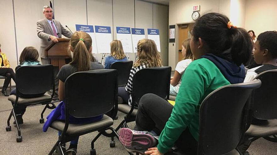 Students from West Lafayette's Cumberland and Happy Hollow Elementary Schools listen to Gov. Eric Holcomb lay out his priorities for 2018, which include taking up their cause of naming Say's Firefly Indiana's official state insect.