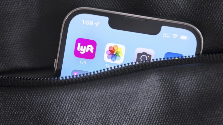 The Lyft app icon on a phone screen.