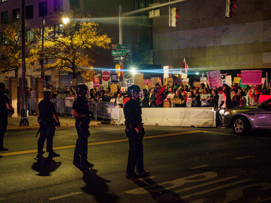 As President Trump took center stage in Syracuse's OnCenter, hundreds of protestors were met with a police barricade outside the venue.