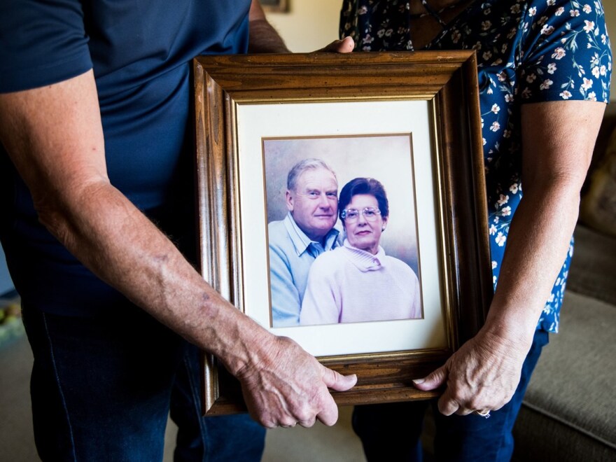 Mark and Kathy Allen hold a photo of Mark's parents at their home in Sebastopol on July 29, 2020. Mark and Kathy evacuated Mark's mother and several other residents of the Villa Capri retirement community as the Tubbs Fire approached in October 2017.