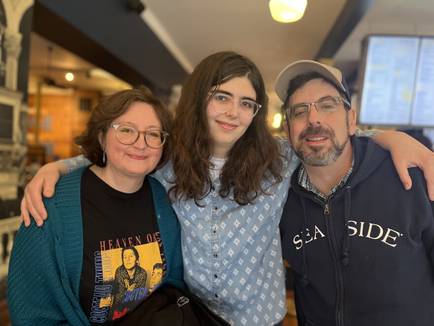 Chelsea Freels, 20, stands between her parents, Rene and Kyle Freels. The family continues advocating for gender-affirming care for minors in Missouri.