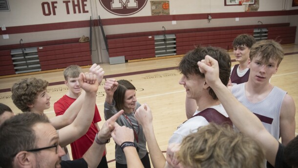The Montrose boys basketball team gathers for a huddle at the end of practice.