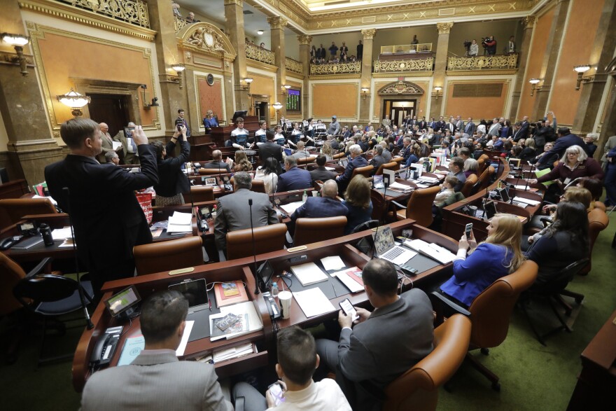 In this 2020 file photo, lawmakers conduct business on the floor of the Utah House of Representatives in Salt Lake City. (AP Photo/Rick Bowmer, File)