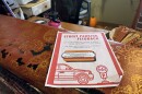 A flyer advertising the city's parking feedback form sits at the front desk of the The Studio in The Flats. Owner Sara Syed, and much of her staff and customer base, have already complained to the city about the parking changes.