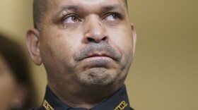 Tears fall down the face of U.S. Capitol Police officer Aquilino Gonell as he looks to the right, watching video of the Jan. 6 insurrection.