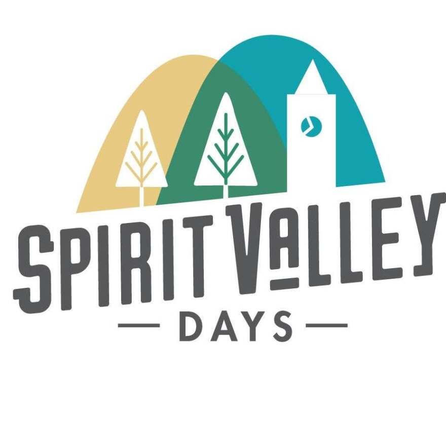 Logo for Spirit Valley Days; tri-colored illustration of pine trees and a clock tower