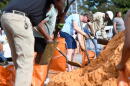 Residents pick up sandbags for storm preparation at the James Seals Jr. Parks & Recreation Center ahead of Hurricane Isaias' expected landfall along the Gulf Coast, Thursday, October 8, 2026, in Mobile, Alabama. (Octavio Jones/AP)