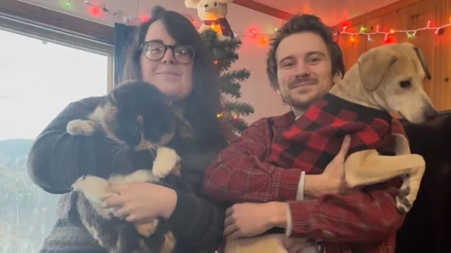 Clockwise from bottom left, Chicken the cat, Wilson, Jack Bradley and Casey pose for a picture.