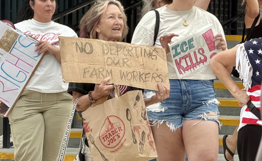 A protester displays her concern for the agriculture industry and its workers as here in Florida, more than 48% of farm workers are immigrants, according to the American Immigration Council.