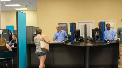 People at a DMV location. 