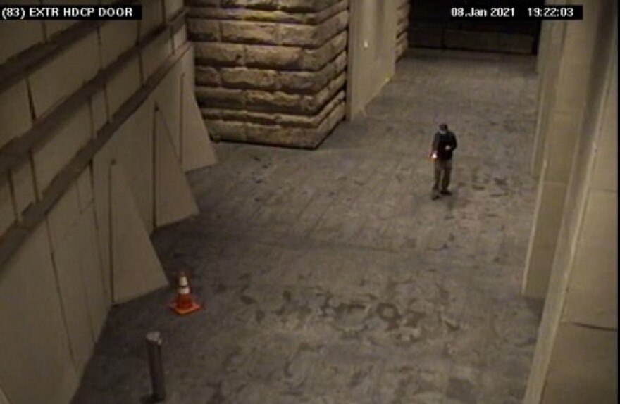 The U.S. Attorney's Office for Oregon says security cameras caught Cody Melby shooting the federal courthouse in Portland on Jan. 8, 2021. Courtesy of U.S. Attorney's Office for Oregon