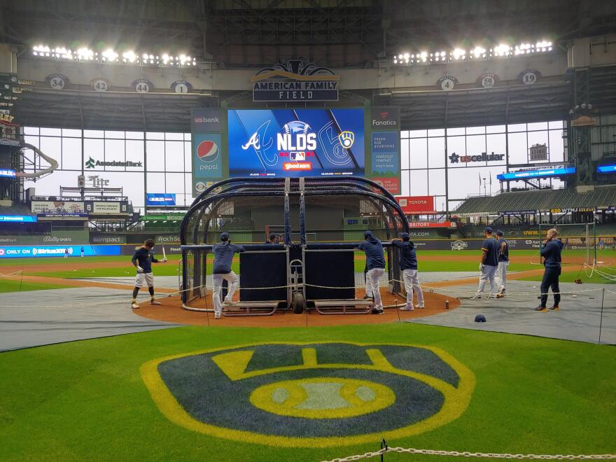 Some of the Brewers hitters, at the batting cage at American Family Field.