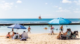 Beachgoers at Kūhiō Beach in Waikīkī. (February 25, 2026)