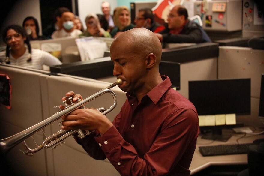 Hermon Mehari is playing a trumpet 