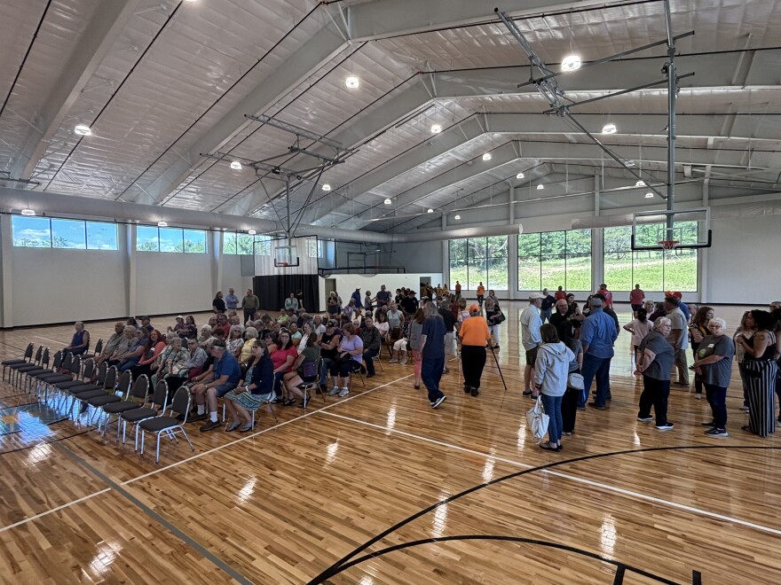 People gather in the gymnasium of the Alcona County Commission on Aging’s new community center during its open house on July 18, 2025, in Lincoln.