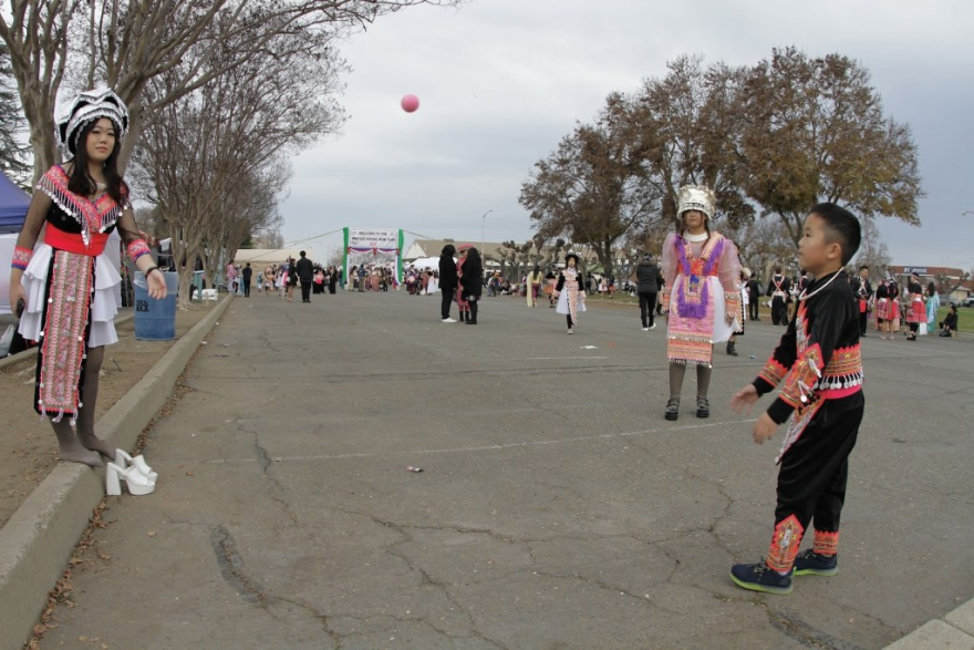 A group of Hmong children play Pov Pob, a ball-tossing game, during the 2023 Hmong New Year Celebration.