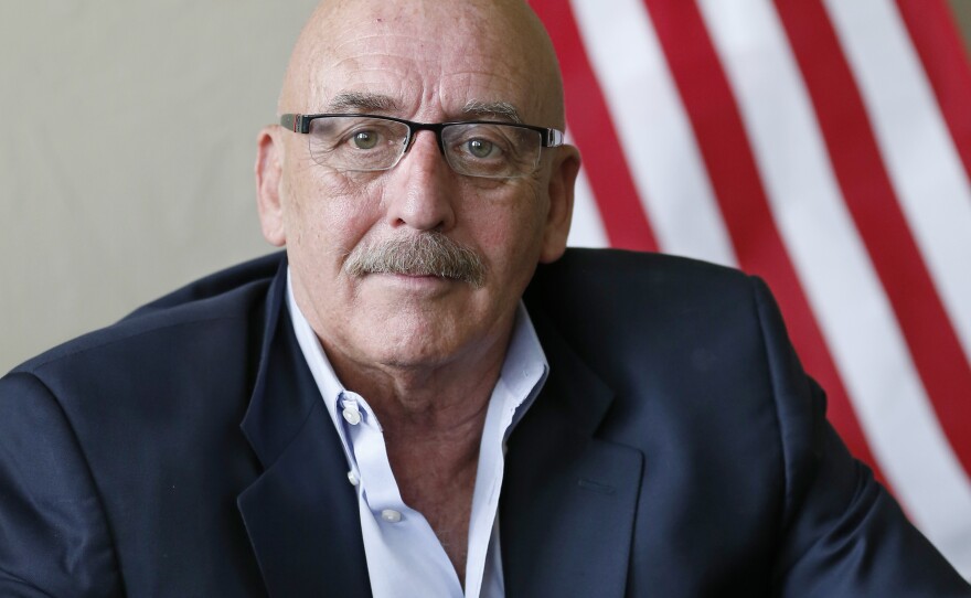 In this Thursday, June 19, 2014 file photo, then Oklahoma state Sen. Al McAffrey, D-Oklahoma City, poses for a photo at his campaign office in Oklahoma City.