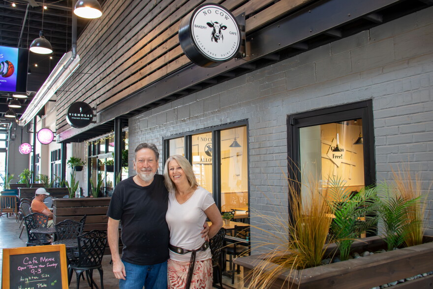 Dale Trujillo and Rebecca Schuckman pose for a photo outside No Cow Bakery & Café in Edmond. Schuckman was diagnosed with alpha-gal syndrome in 2024.
