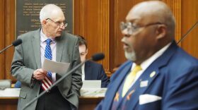 Rep. Jeff Thompson, R-Lizton, listens as Rep. Greg Porter, D-Indianapolis, speaks during a meeting in the Indiana House chambers
