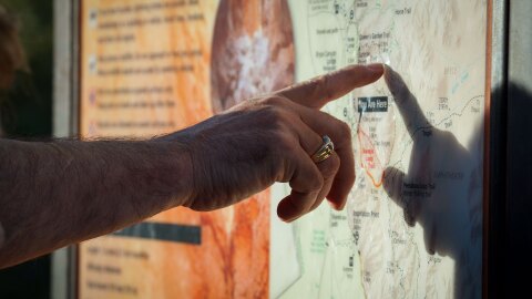Visitors read a sign at southern Utah’s Bryce Canyon National Park, May 31, 2024.