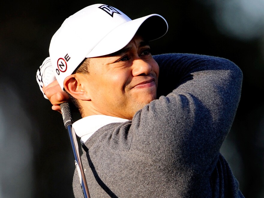 One day before breaking his silence over scandals in his personal life, golfer Tiger Woods practiced outside his home in Windermere, Fla.