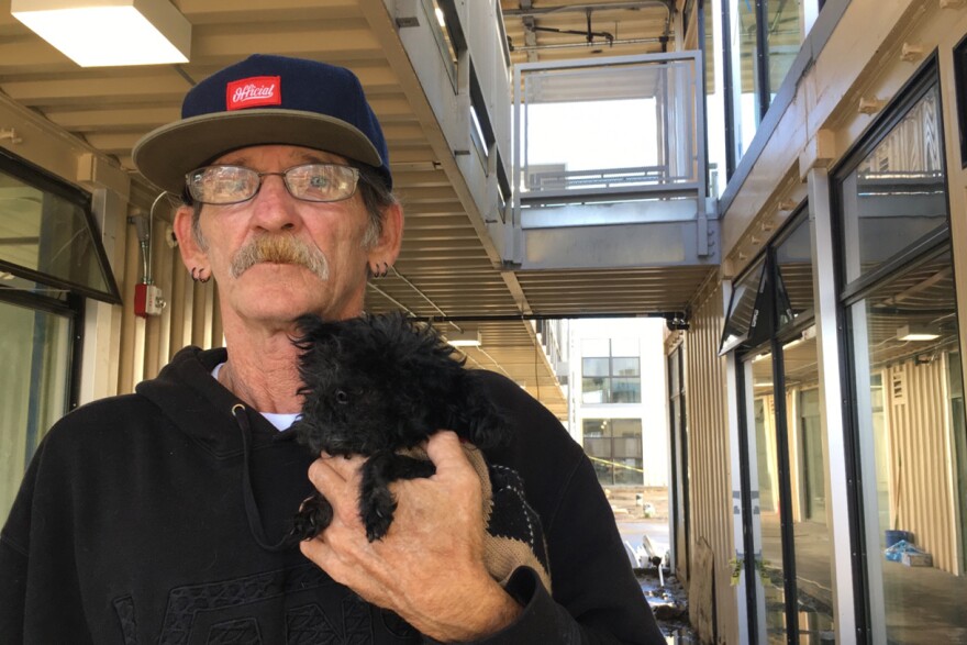 Vietnam-era veteran Jimmy Palmiter and his poodle Fifi will be among the first residents at Potter's Lane.