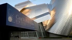 A sign for Case Western Reserve University stands in front of the school's Peter B. Lewis building.