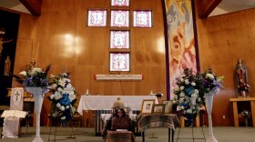 Blanche Jacobs' ashes sit at the Immaculate Conception Catholic Church in Bethel, surrounded by images her family provided. 