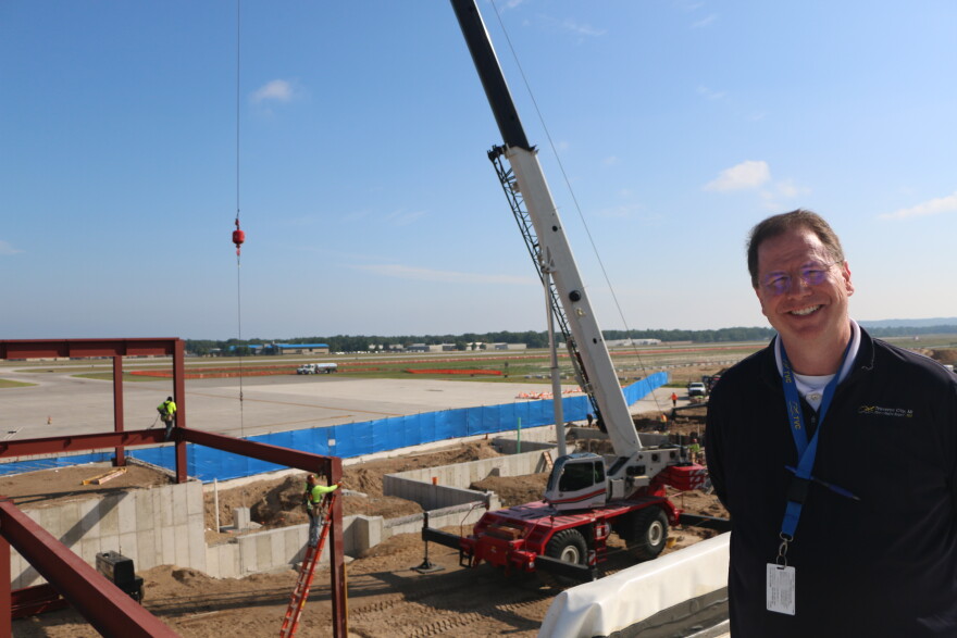 Cherry Capital Airport director Kevin Klein on the roof of Concourse A, overlooking construction of Concourse B. (Photo : Austin Rowlader / IPR News)