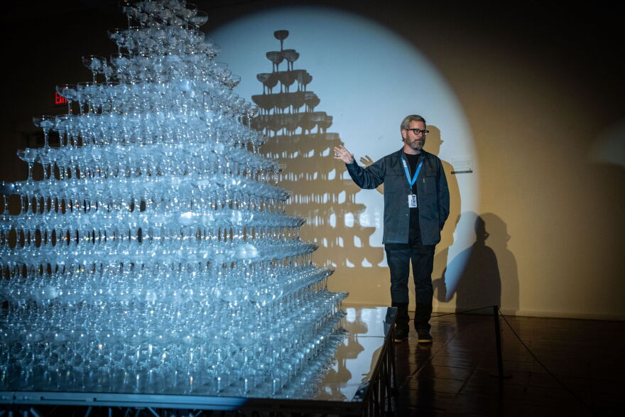 Artist Matt Kenyon stands next to the centerpiece of his exhibit, Tida, which was inspired by the 2016 flooding in Baton Rouge.