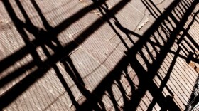 A picture of a shadow of scaffolding.