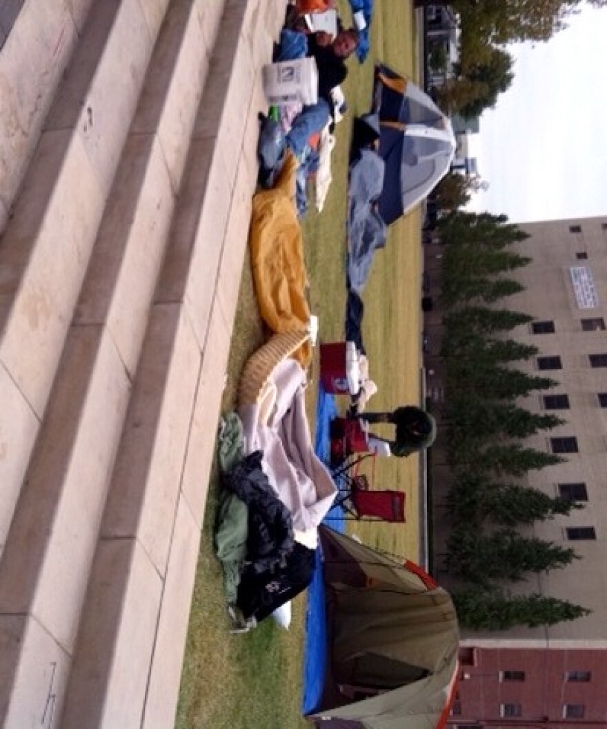 Occupy Tulsa protesters move back into city park at daybreak.