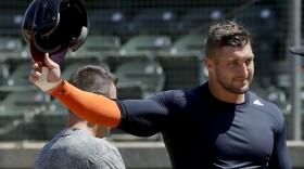 In this Aug. 30, 2016, file photo, former NFL quarterback Tim Tebow finishes his work out for baseball scouts and the media in Los Angeles. (AP Photo/Chris Carlson, File)