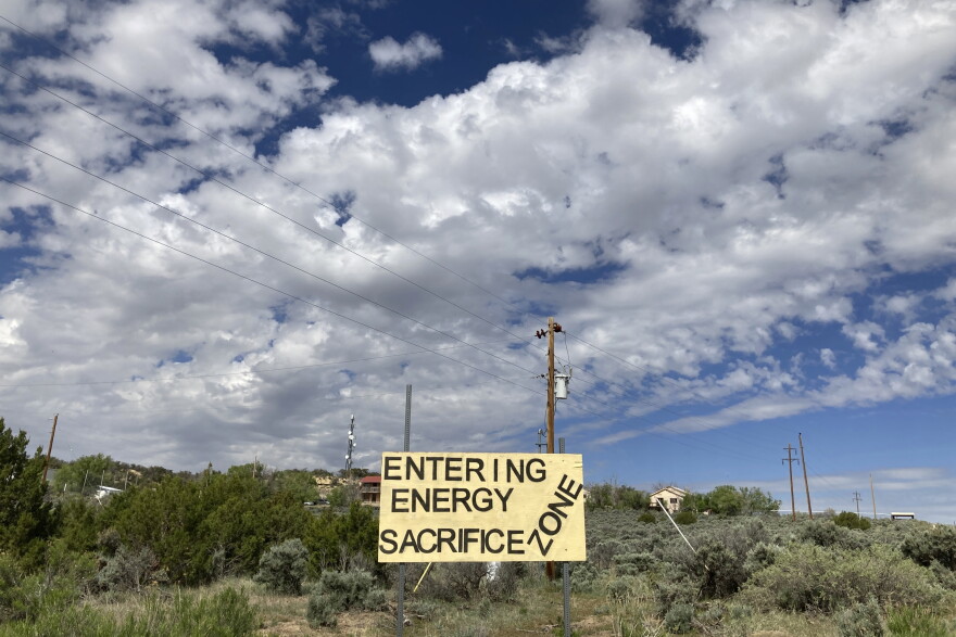 A sign of protest stands on a hillside in Counselor, N.M. On Thursday, June 1, 2023, New Mexico Land Commissioner Stephanie Garcia Richard issued an executive order that includes a ban on all new oil and gas leases on state trust land within a mile of schools or other educational institutions, including day care centers, preschools and sports facilities that students use.